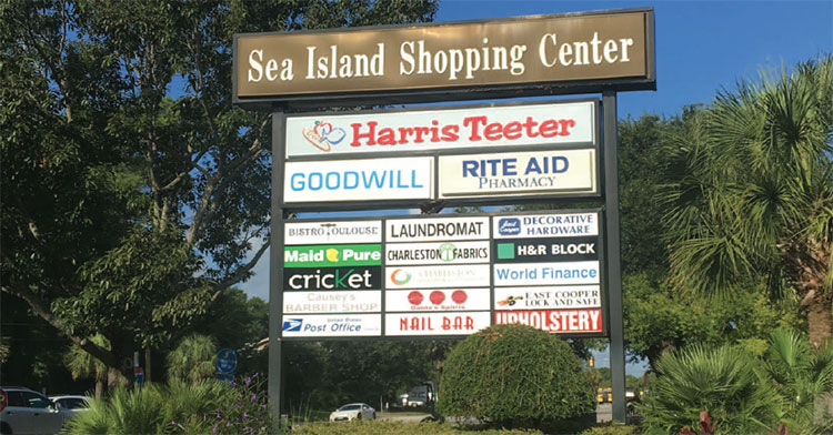 Sea Island shopping Center signs show the center's businesses