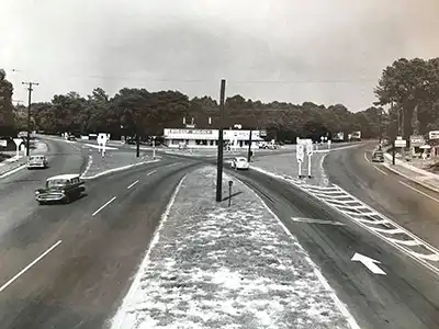 In an historic 1959 photo, get a glimpse of the intersection of Coleman Blvd, Ben Sawyer Blvd, and Chuck Dawley Blvd. Today Royall Ace Hardware would be off to the right outside of the photo.